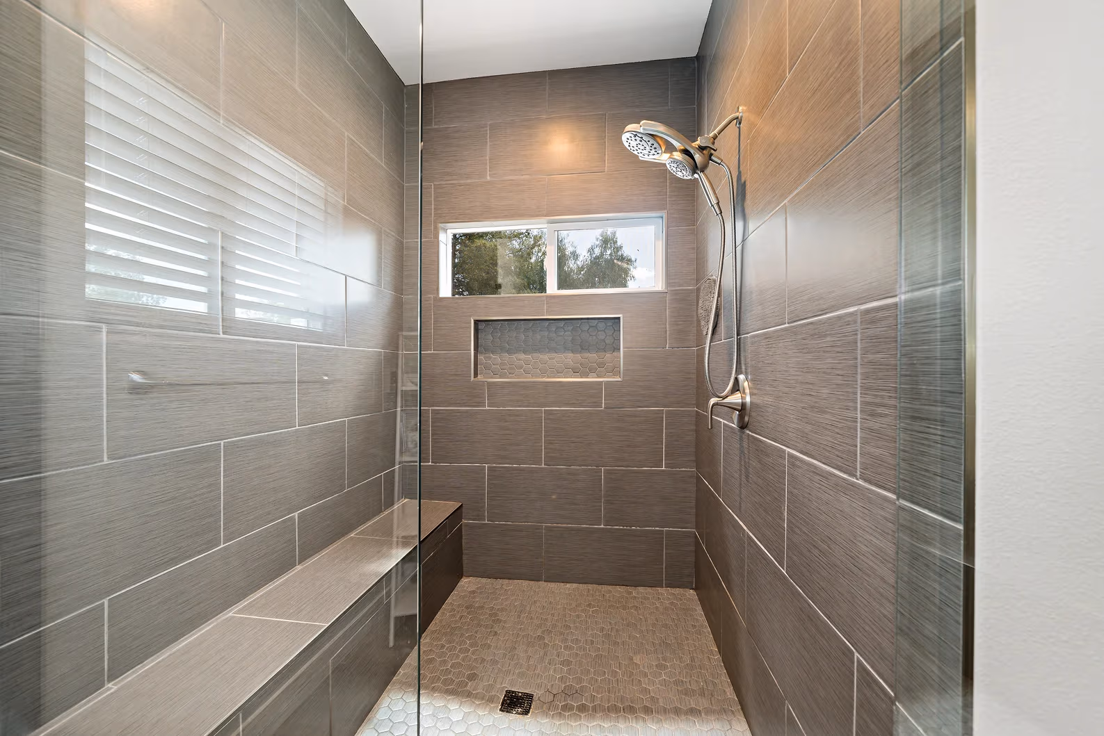 Contemporary ADU bathroom with white tiles and modern vanity
